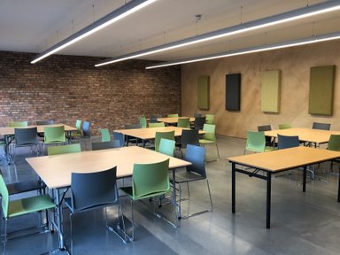 Community Room with tables and chairs
